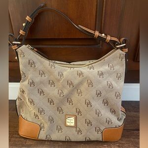 Dooney & Bourke Signature Print.  Tan Canvas.  Red Interior.